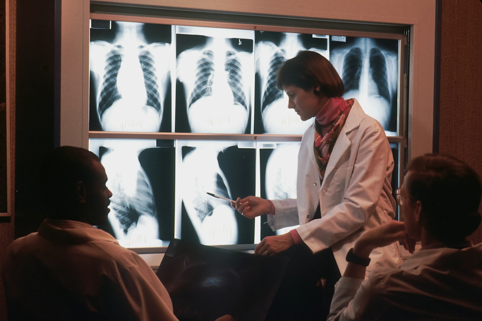 Mark Is Me: Home 4 a doctor talking to a patient in front of a x - ray